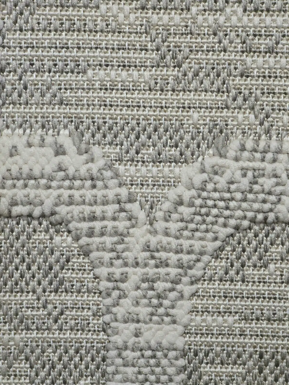 Macro shot showing tight woven base and elevated lattice pattern on Twilight Rug