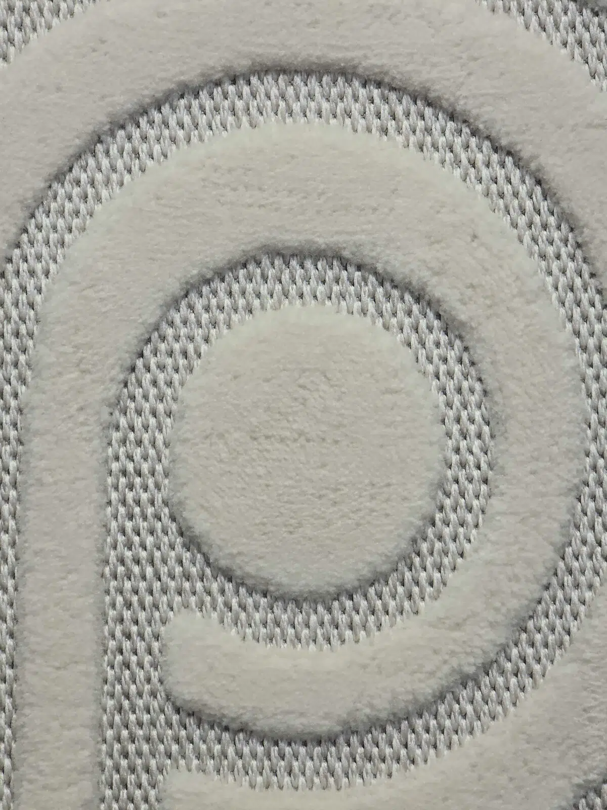 Macro shot of Nebula rug’s soft plush circle at the center of the loop