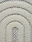 Extreme close-up of Orion rug’s plush arched design in white