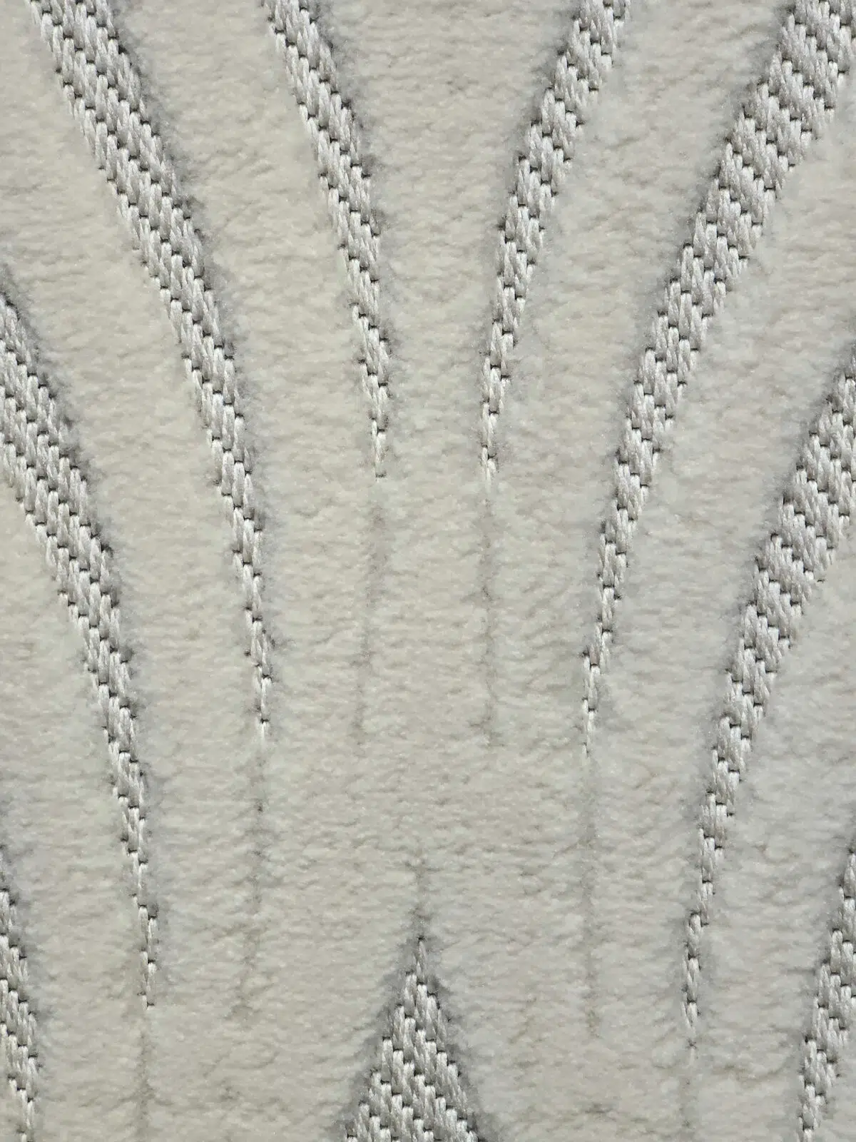 Close-up of Titan rug showing textured yarn with raised wave design