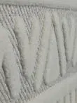 Side perspective of Apollo Rug showing elevated V-shaped patterns