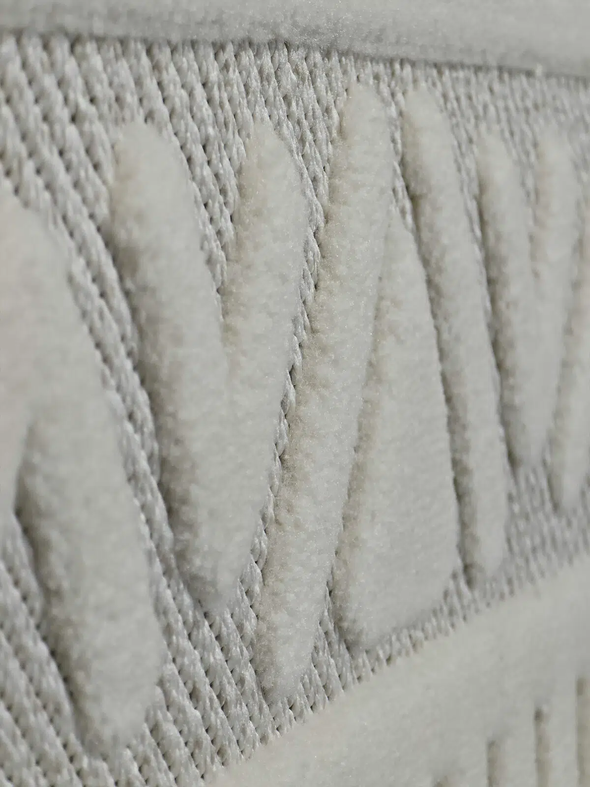 Side perspective of Apollo Rug showing elevated V-shaped patterns