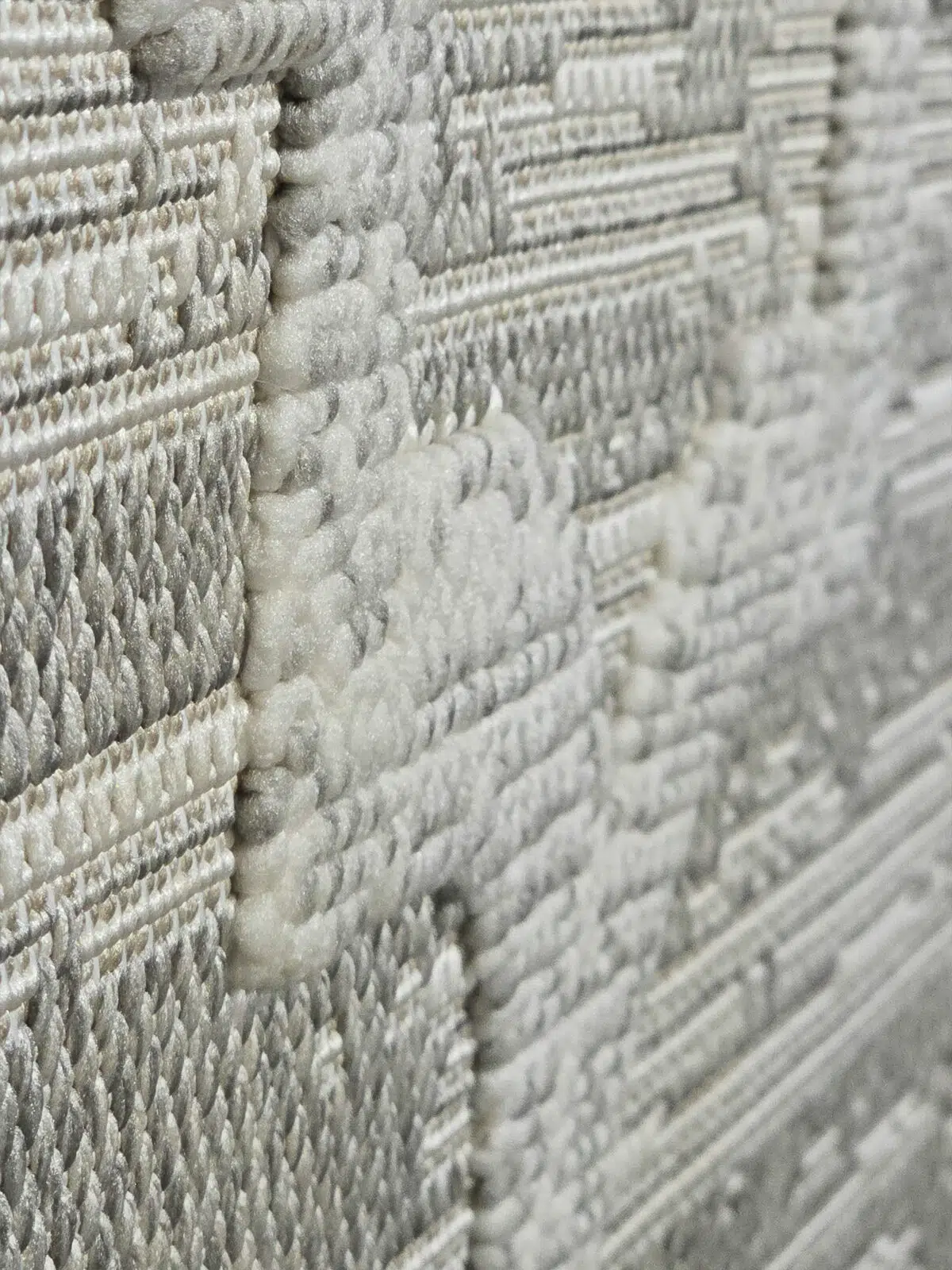 Side closeup of Twilight Rug showing plush feel and woven relief pattern