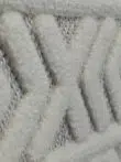 Side view close-up of white Luna rug showing plush V-patterns