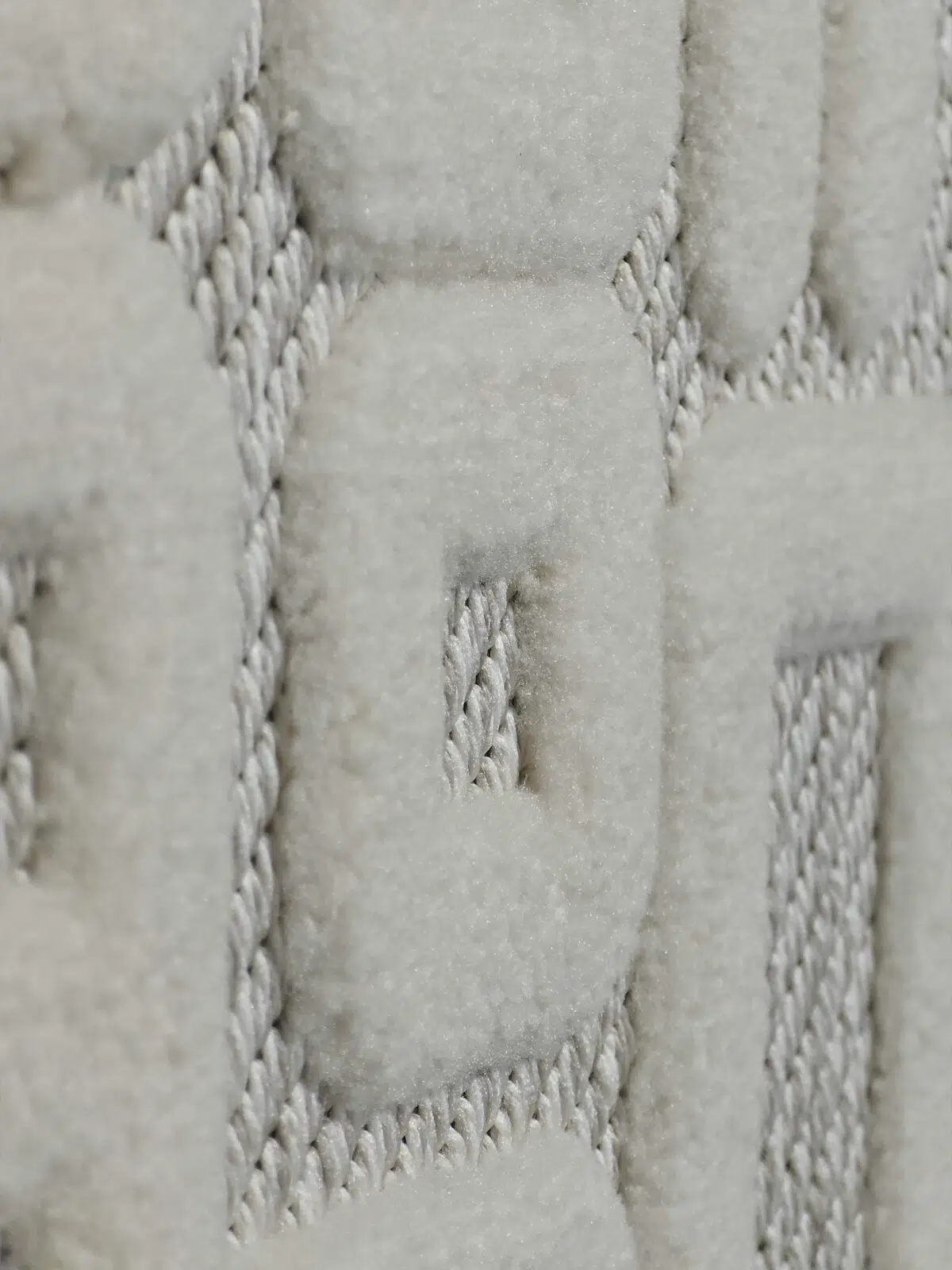 Angled side view of Vega Rug highlighting the depth and weave