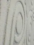 Angled close view showing concentric loop design and soft fabric on Nebula rug