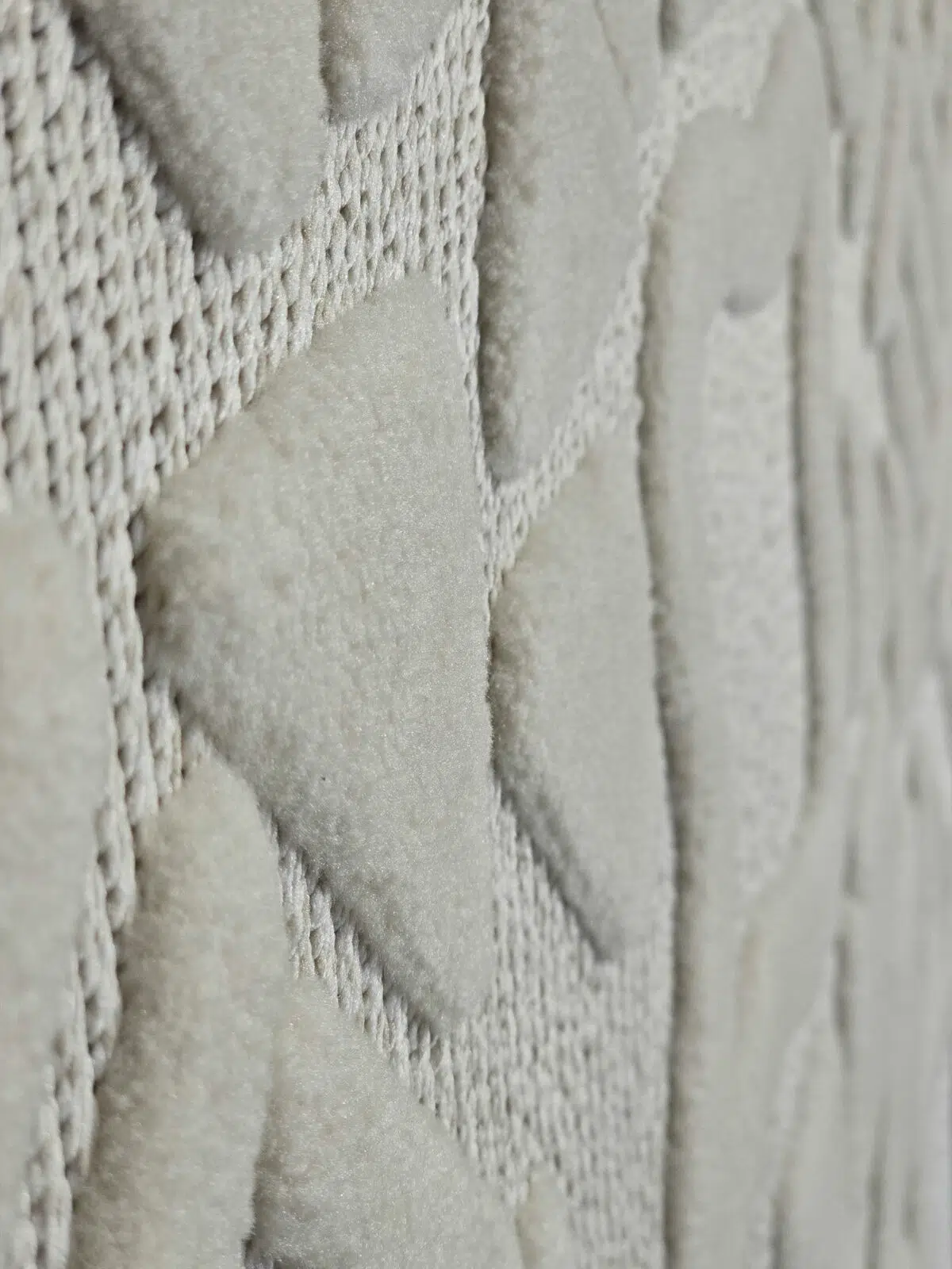 Slanted close-up of Apollo Rug showing triangular elements in high pile