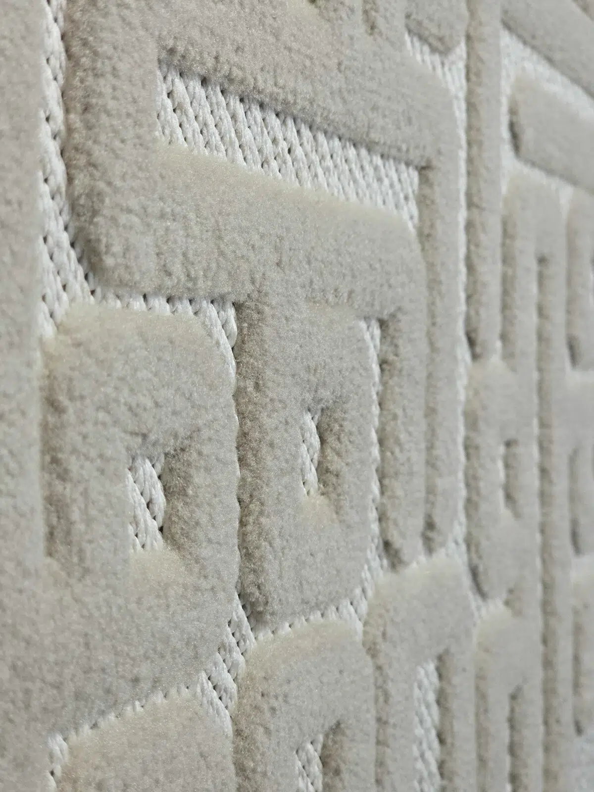 Detailed view of Aurora rug’s acrylic loop construction