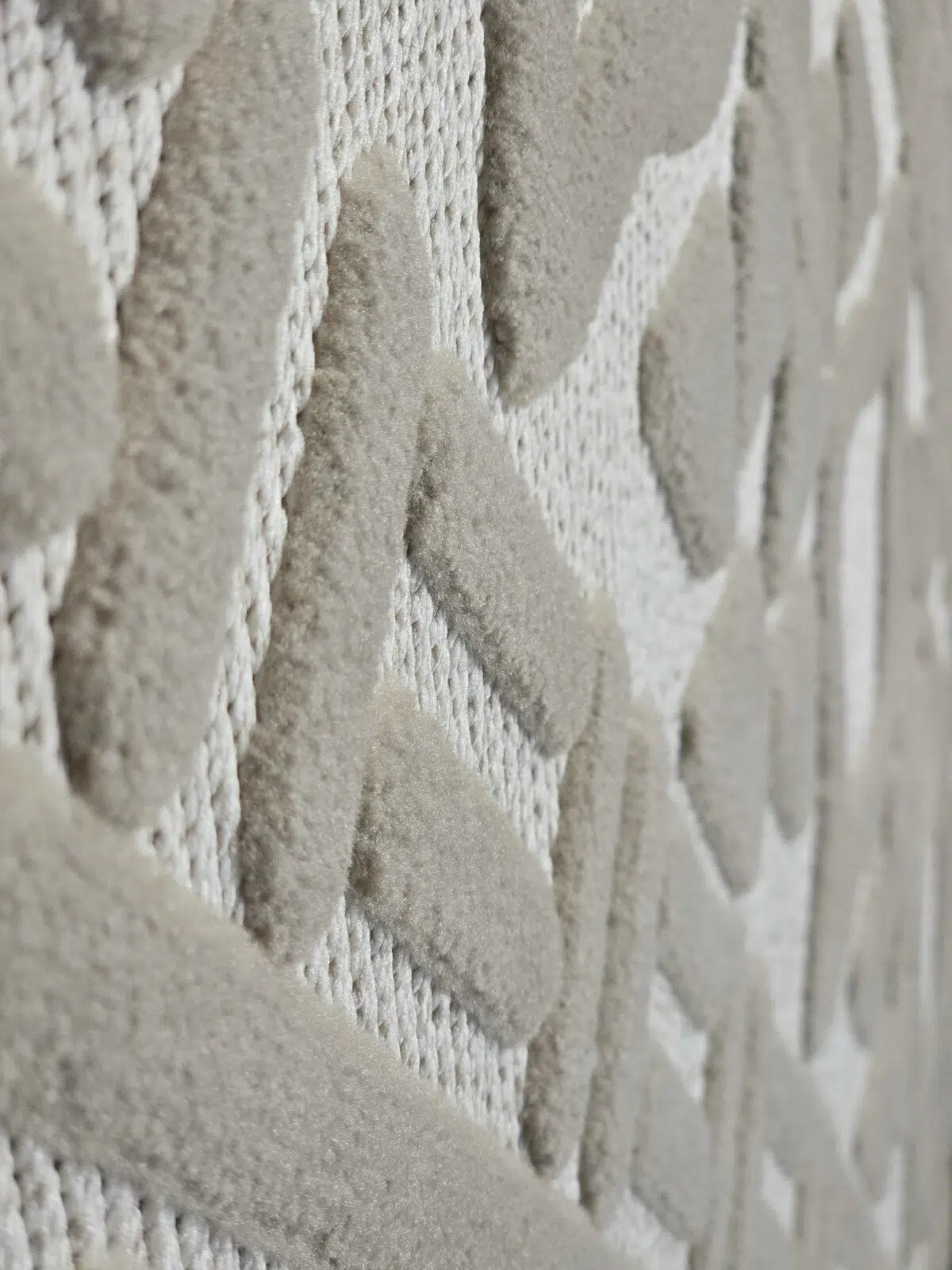 Angled texture shot of Eclipse rug’s triangle and stripe design