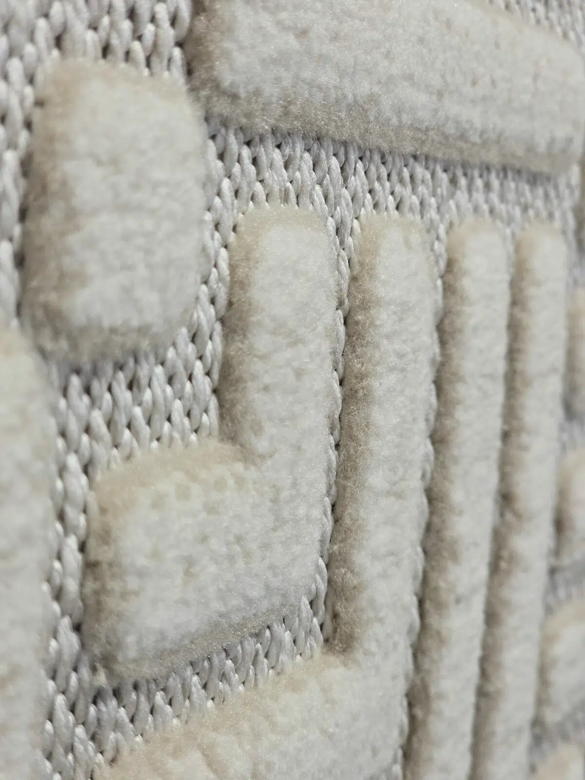 Tactile texture of triangle design on Lyra rug close-up