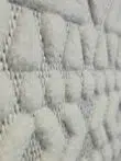 Diagonal angle showing dense texture and diamond pattern of Nova rug