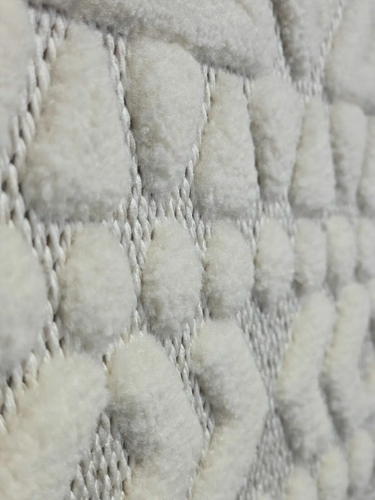 Diagonal angle showing dense texture and diamond pattern of Nova rug