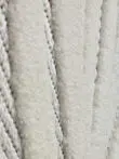 Detail view of Titan rug’s flowing raised pattern in soft fabric
