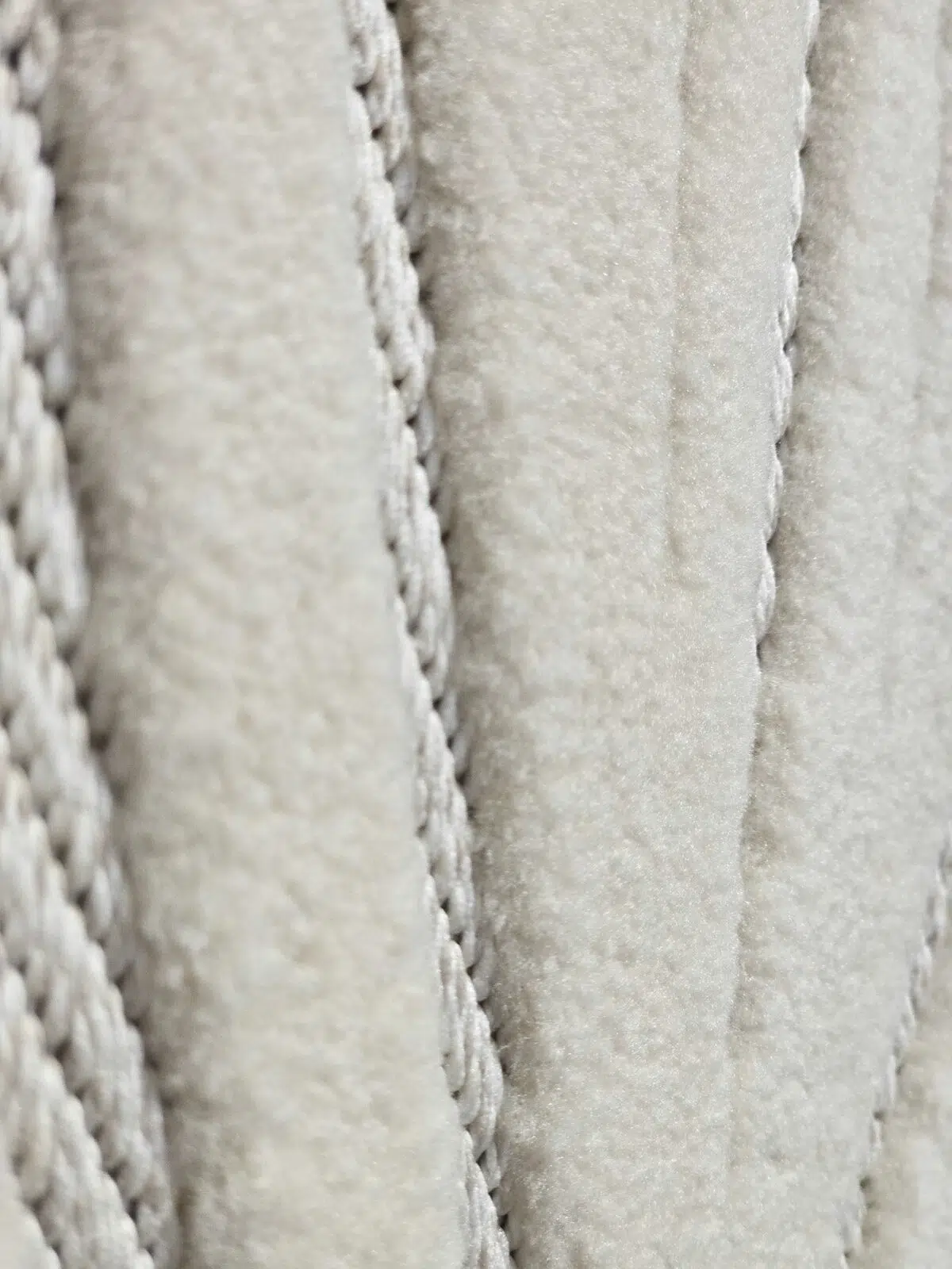 Detail view of Titan rug’s flowing raised pattern in soft fabric