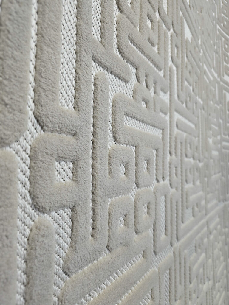 Angled close-up of Aurora rug highlighting 3D lines