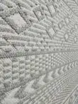 Close-up of plush grey and ivory vertical weave on Equinox rug