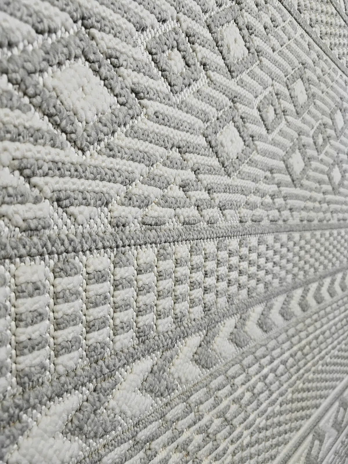 Close-up of plush grey and ivory vertical weave on Equinox rug