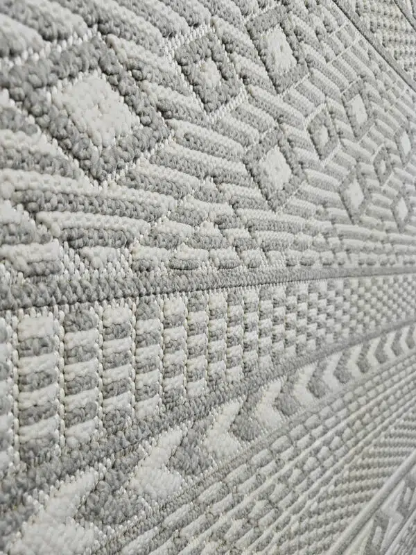 Close-up of plush grey and ivory vertical weave on Equinox rug
