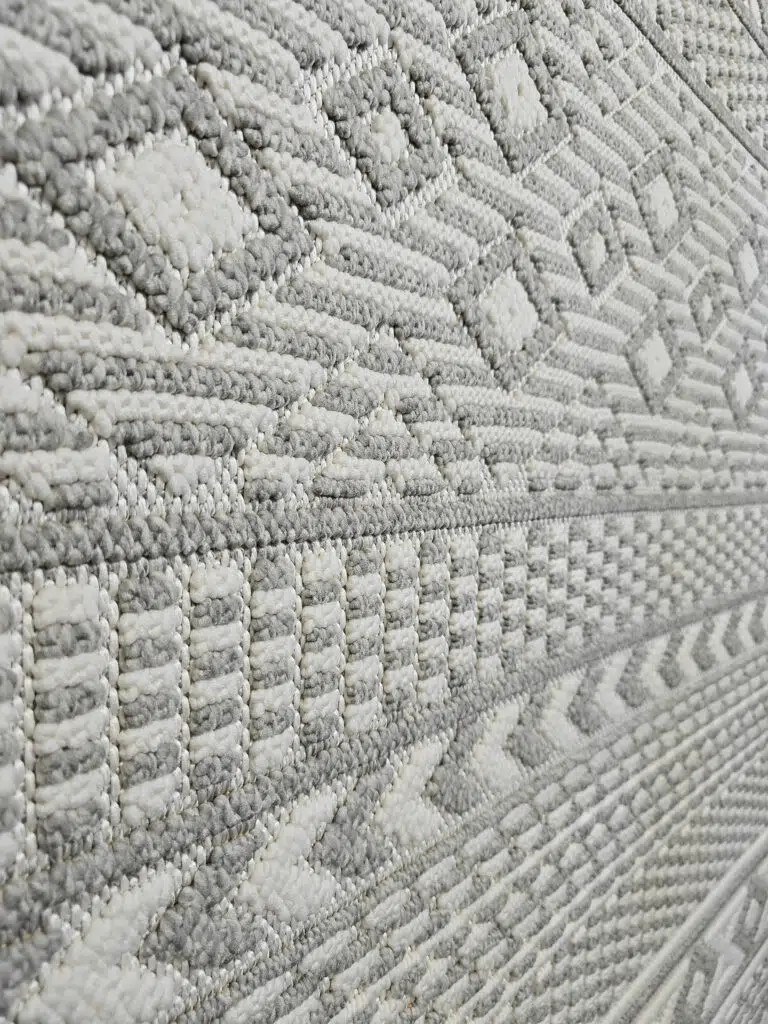 Close-up of plush grey and ivory vertical weave on Equinox rug