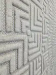 Raised texture of modern Lyra carpet pattern in side angle view