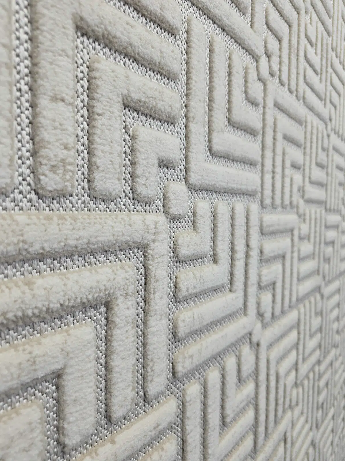 Raised texture of modern Lyra carpet pattern in side angle view