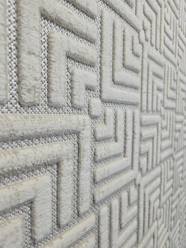 Raised texture of modern Lyra carpet pattern in side angle view