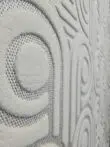 Side pattern view of Nebula carpet showing round and linear raised shapes