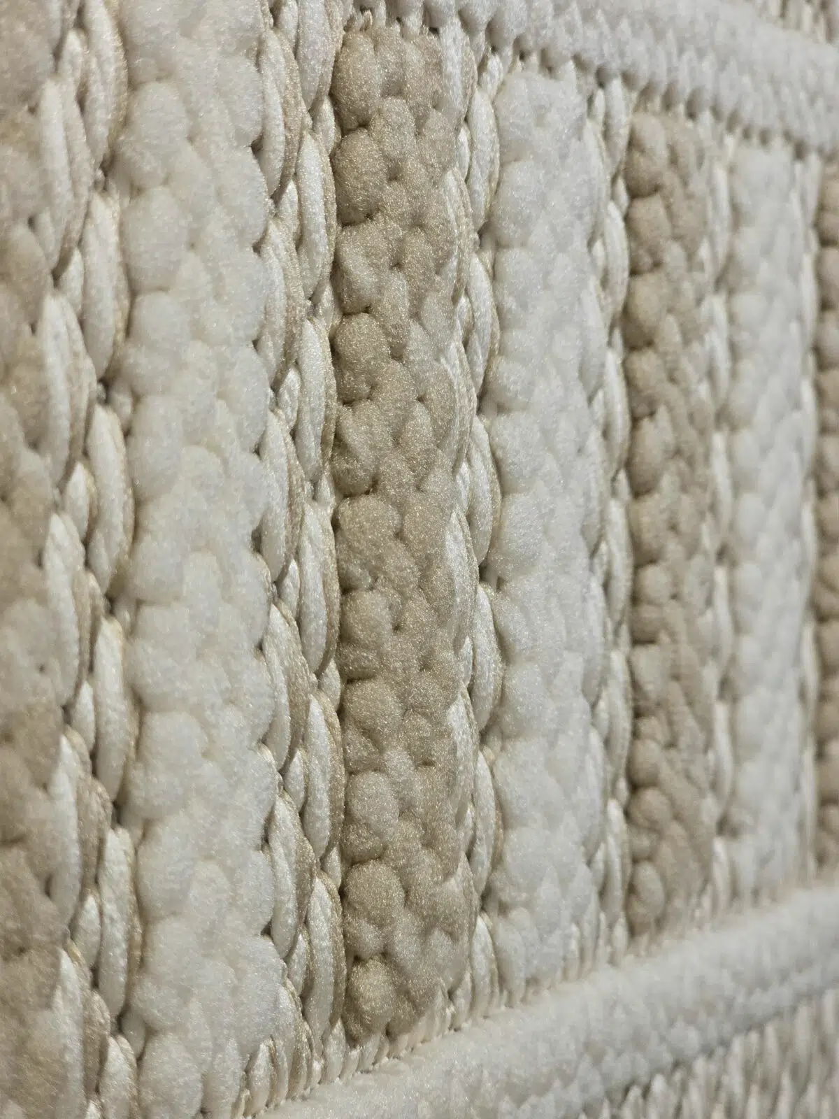 Detailed texture view of beige and white stripes on Radiant rug
