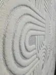Side angle capturing Sirius rug’s continuous curve design