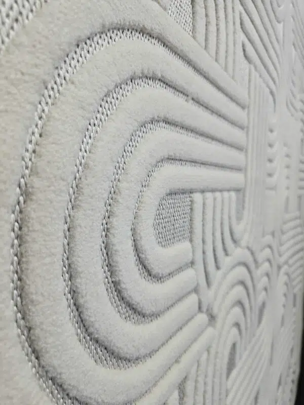 Side angle capturing Sirius rug’s continuous curve design