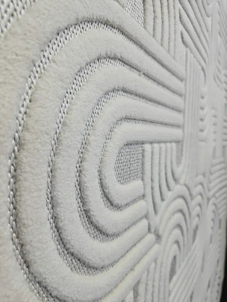Side angle capturing Sirius rug’s continuous curve design