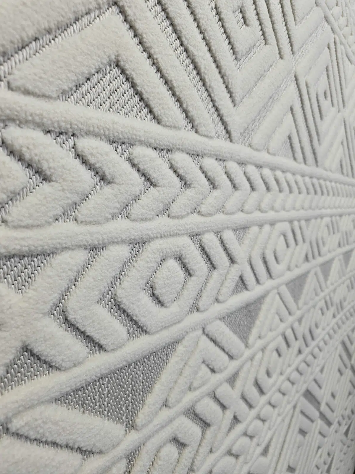 Side wide view of Luna rug displaying layered geometric patterns
