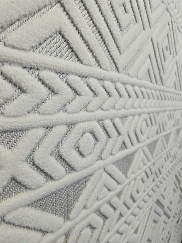 Side wide view of Luna rug displaying layered geometric patterns