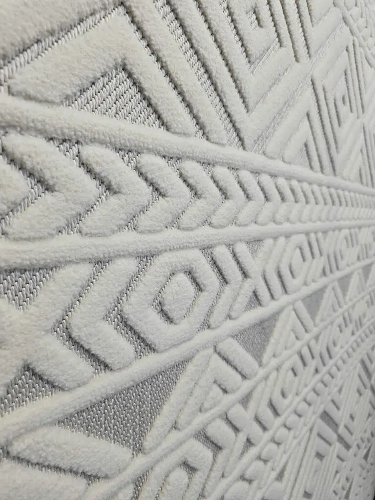 Side wide view of Luna rug displaying layered geometric patterns