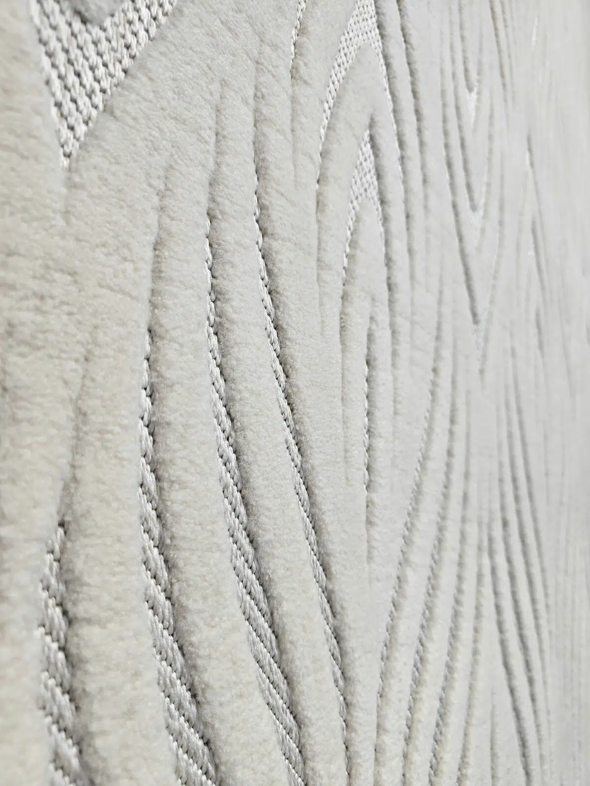 Side view showing soft plush flow of wave-like design on Titan rug