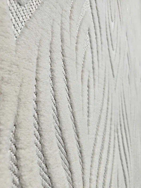 Side view showing soft plush flow of wave-like design on Titan rug