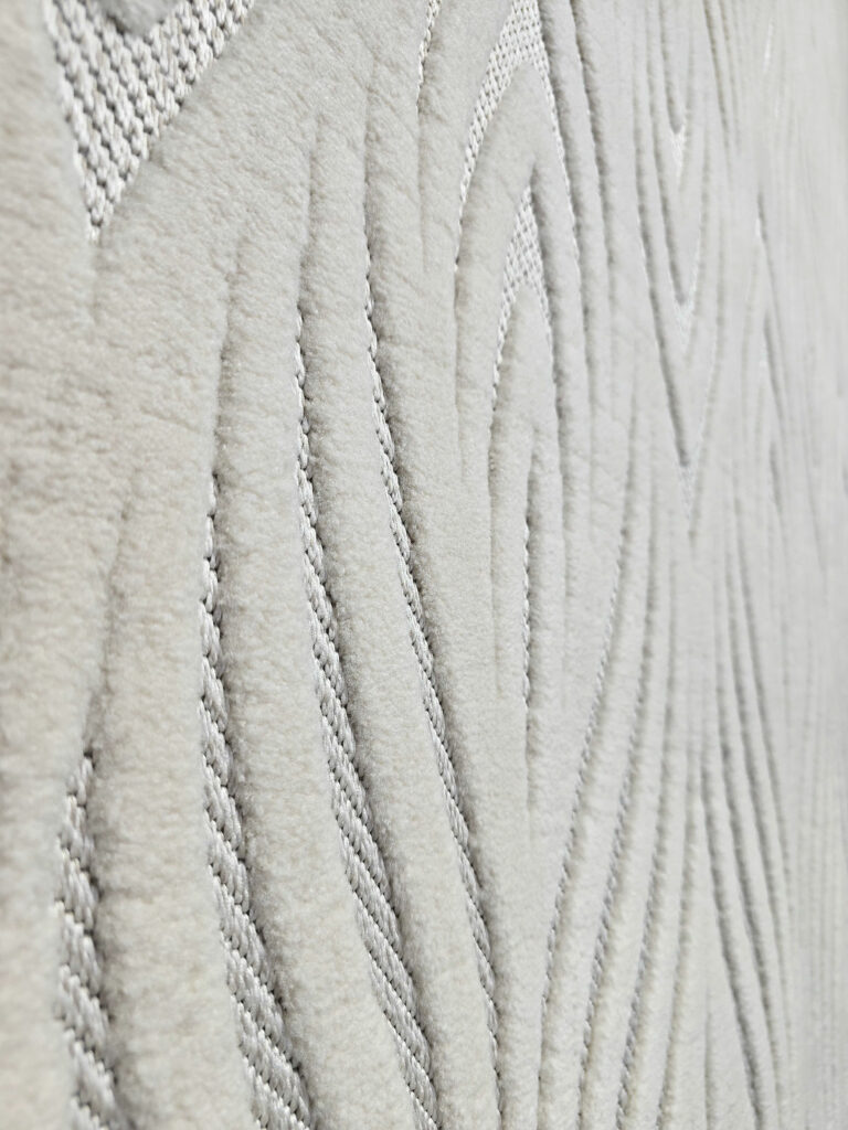 Side view showing soft plush flow of wave-like design on Titan rug