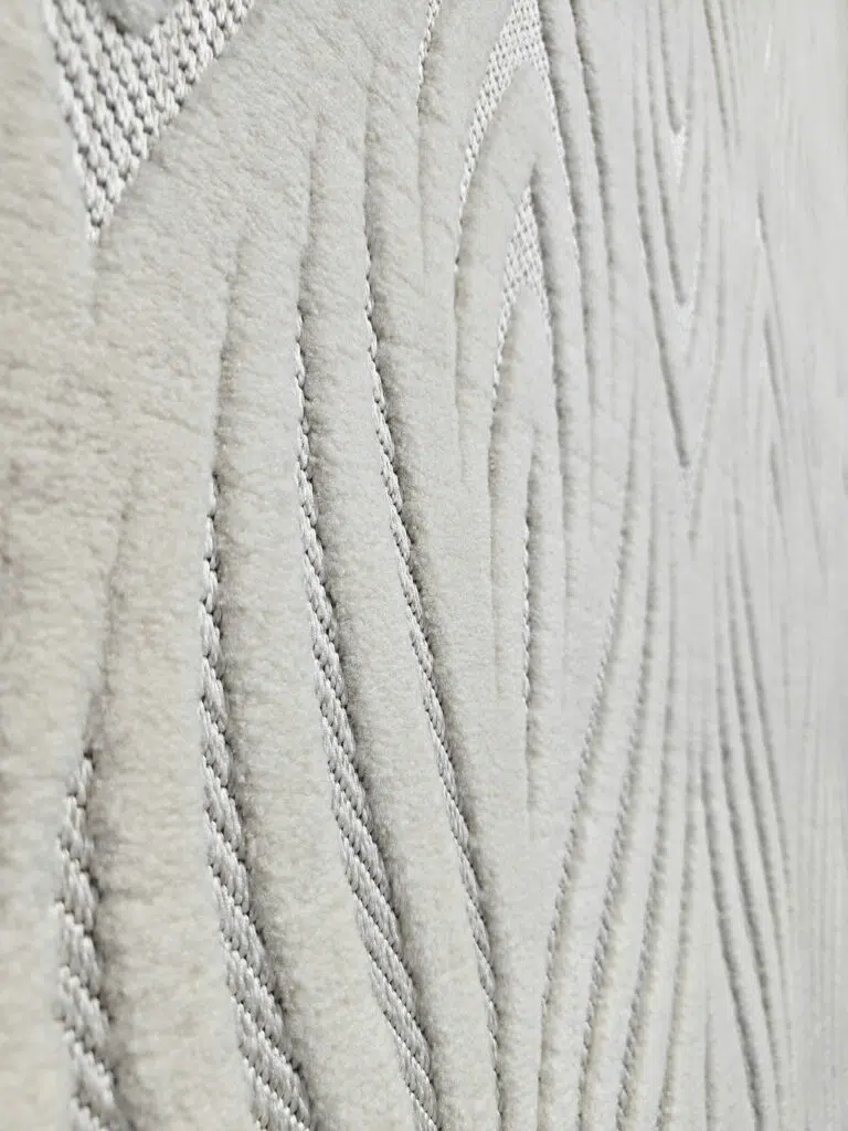 Side view showing soft plush flow of wave-like design on Titan rug