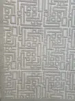 Flowing lines in Aurora rug’s raised geometric design