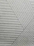 angled close-up showing Solaris Rug’s layered chevron motif
