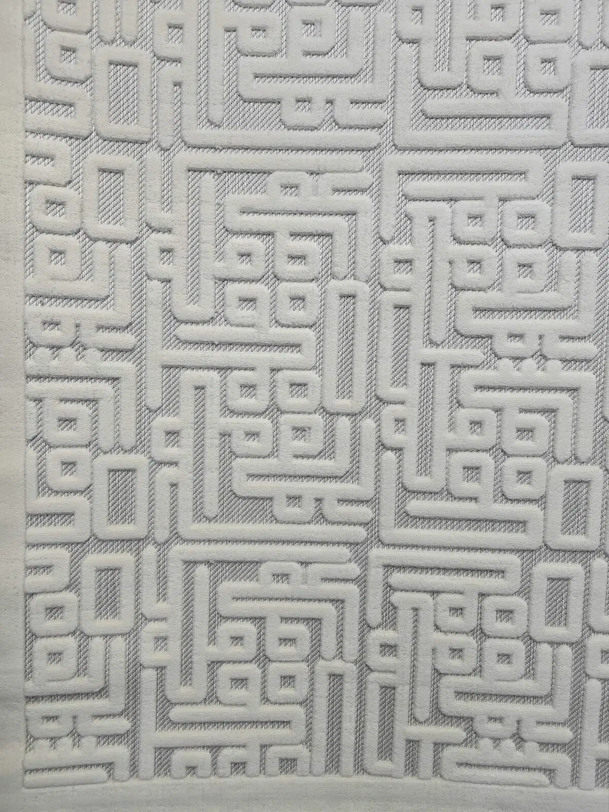 Repeating Kufic-style pattern of Vega Rug with symmetry and order