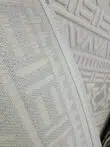 Backside of Apollo Rug showing fine stitched backing and woven texture