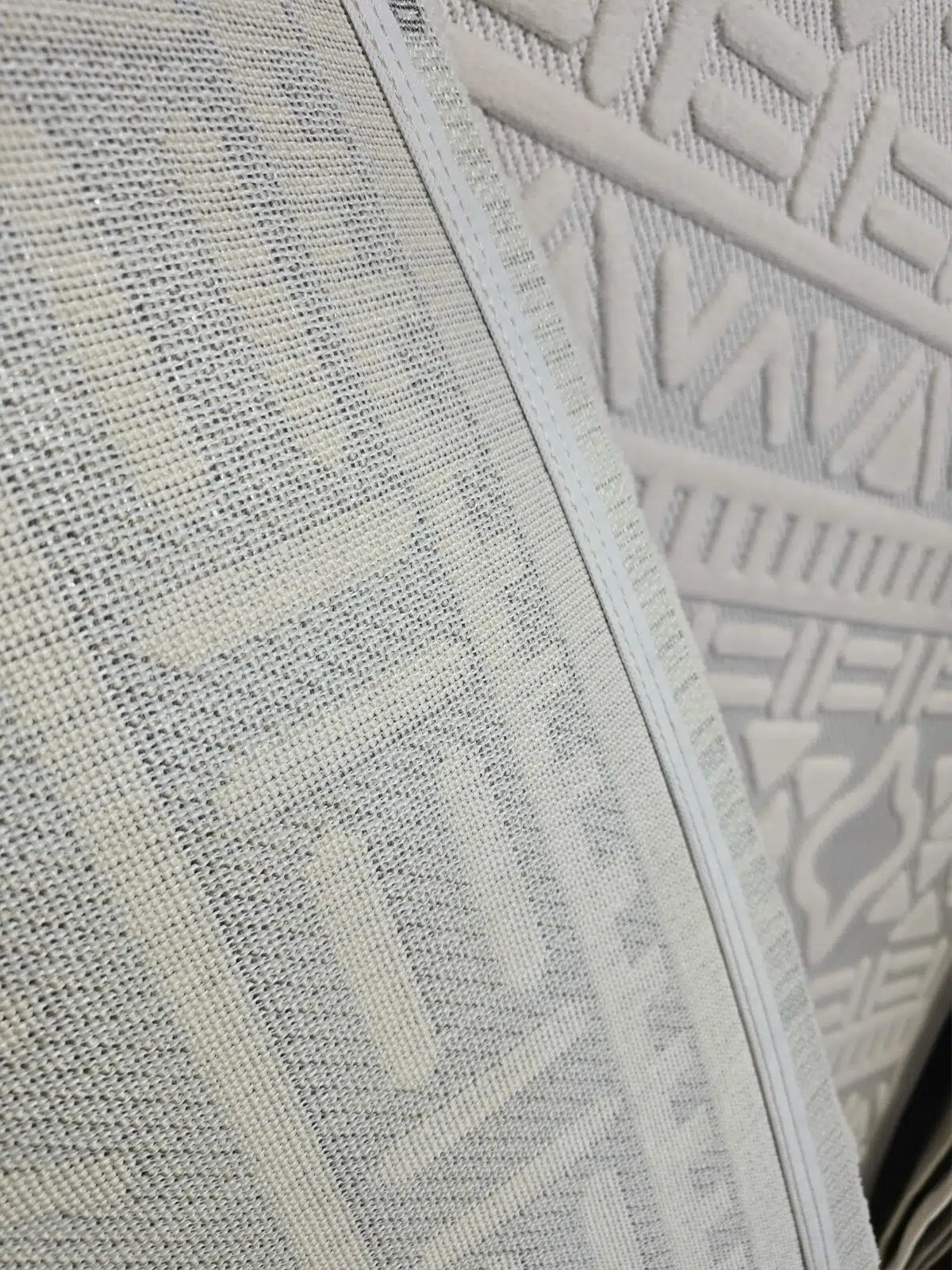 Backside of Apollo Rug showing fine stitched backing and woven texture