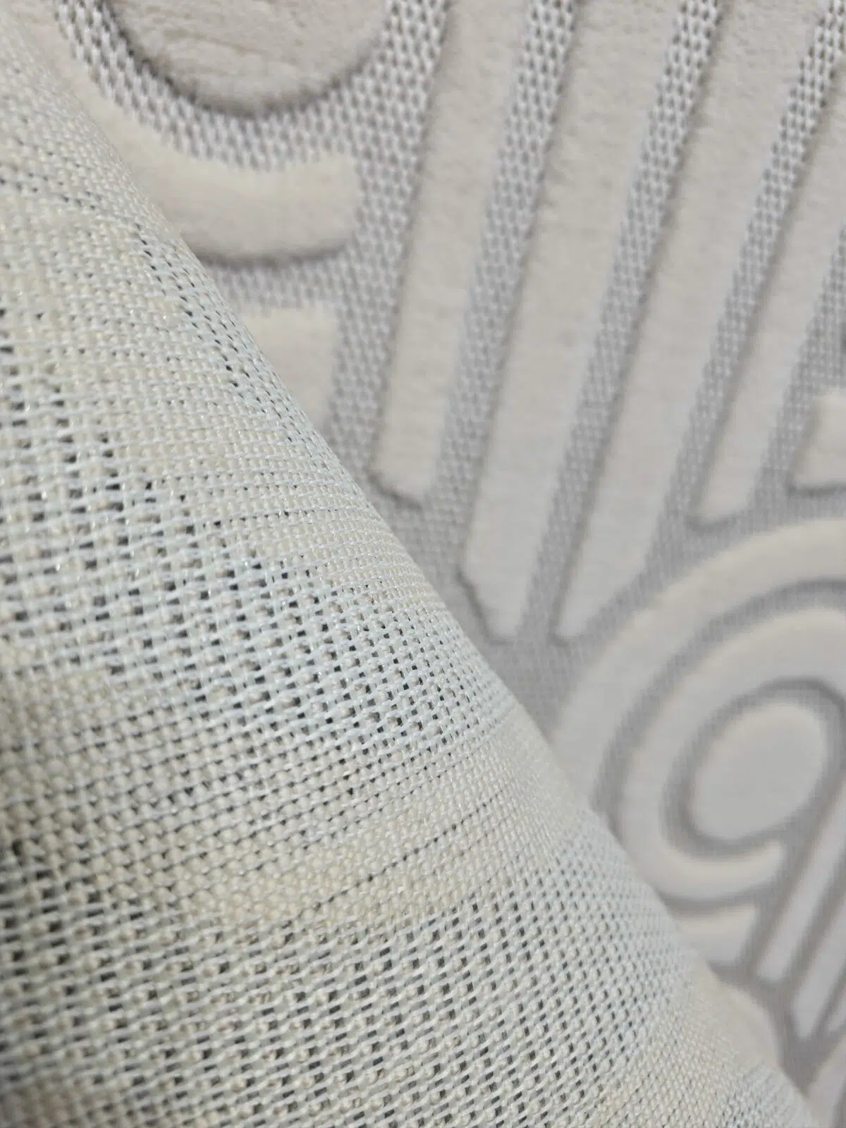 Rear view of Nebula rug showing fine mesh backing and weave structure