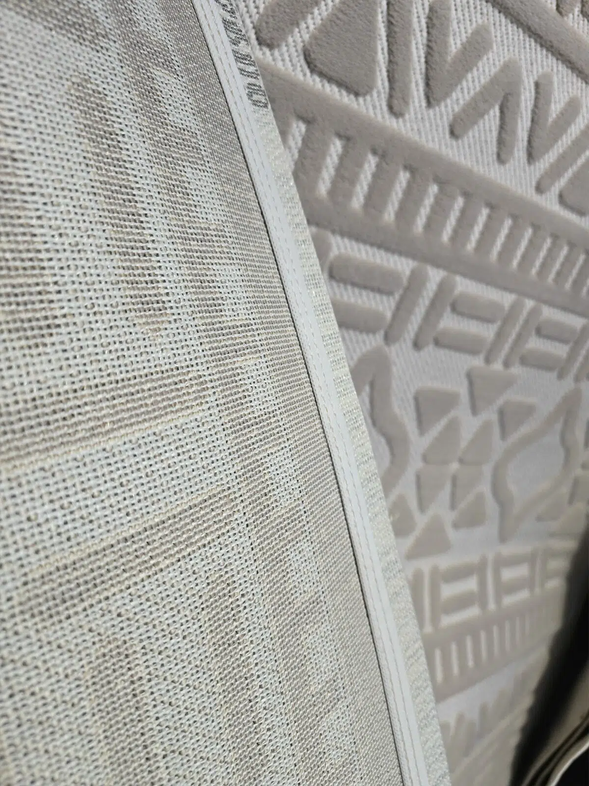 Underside of Eclipse rug showing strong mesh backing