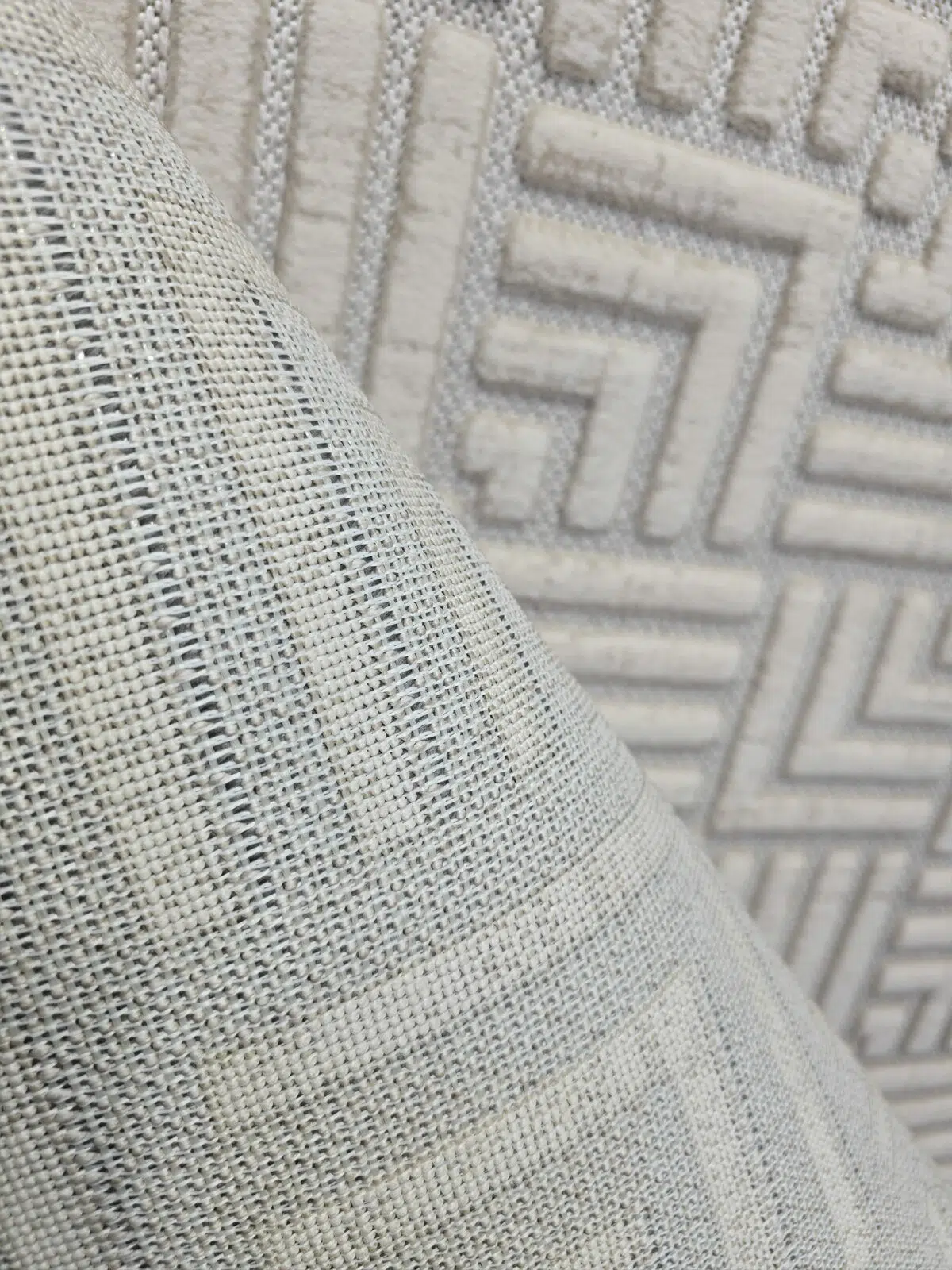 Backside texture of Lyra carpet showing fine machine-made weave