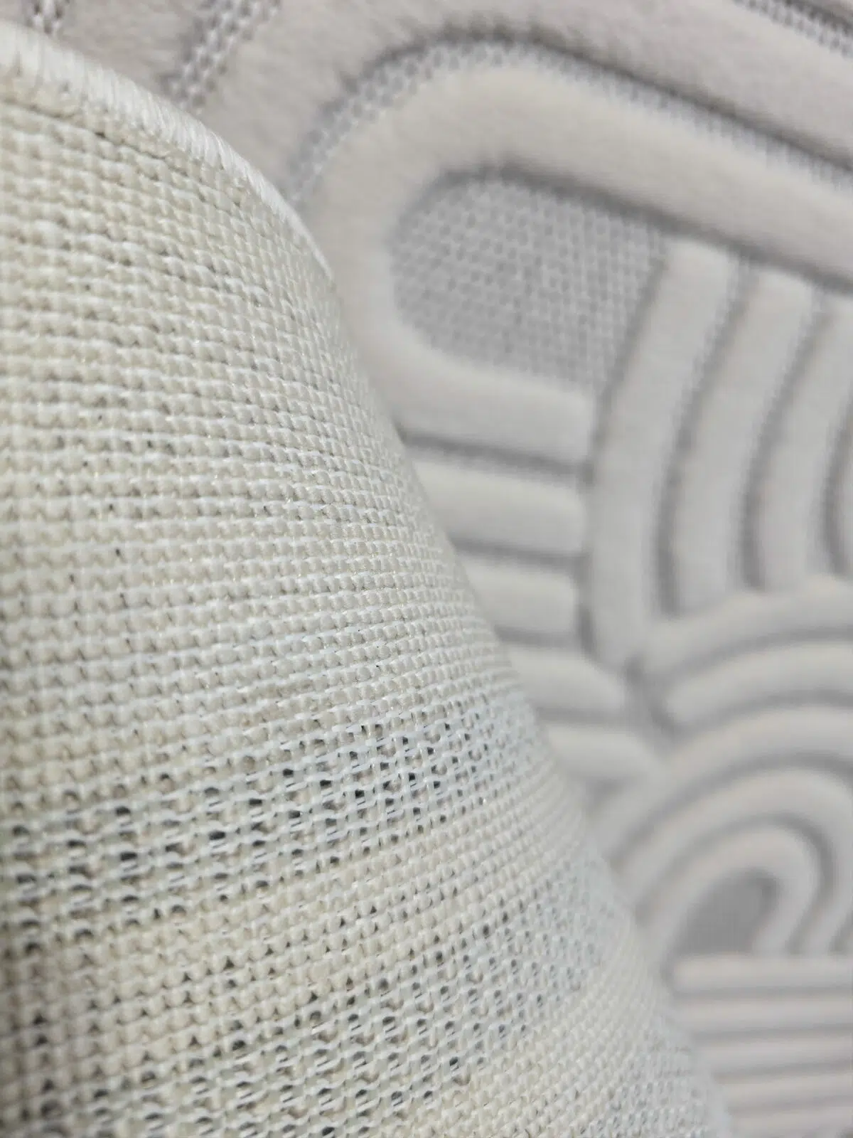 Underside view of Sirius rug showcasing strong mesh backing