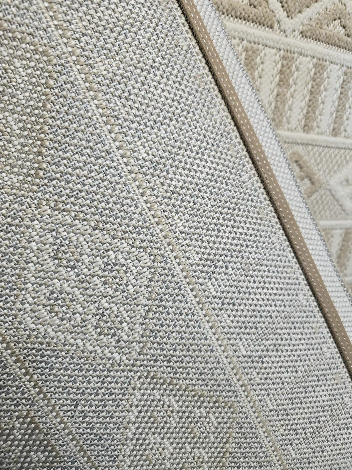Radiant rug’s reinforced back showing dense weave and brown leather edging