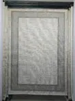 Entire front image of Juno carpet with dual grey border on cream base