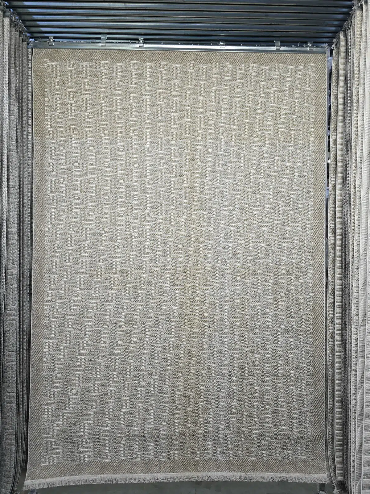 Front full view of Oberon rug showing beige geometric pattern